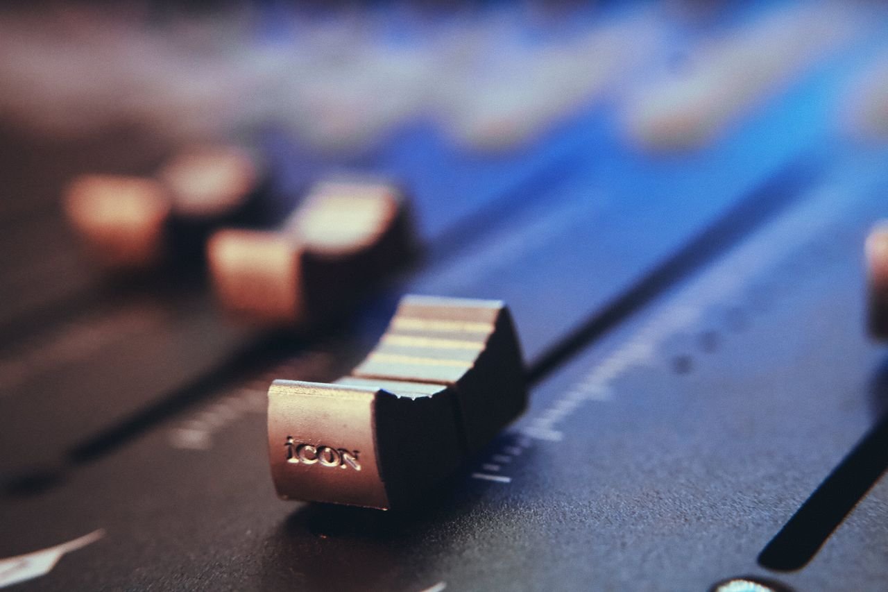 Home Detailed view of an audio mixer fader and slider with a selective focus effect.